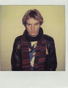 a polaroid photograph of a man wearing a scarf