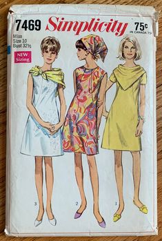 ©1967 Simplicity printed pattern #7469 Misses Dress and Two Scarves: The collarless dress with front seam interest has high round neckline and back zipper. V. 1 has short set-in sleeves. V 2 & 3 are sleeveless. A triangular scarf is worn with all views around neck or on head. The smaller scarf V. 1 & 2 fastens with loop and button when worn around the neck. The larger scarf V. 3 is made of silk-like fabrics only. size 10 bust 32.5 waist 24 hip 34.5 Cut, complete with instructions.  Envelope good Mod Dress Pattern, Dress Pattern Simplicity, 1960s Mod Dress, Simplicity Patterns Dresses, Simplicity Patterns Vintage, Patron Vintage, Small Scarf, Vintage Dress Patterns, Dress Making Patterns