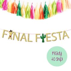 a banner that says final fiesta ready to ship with tassels hanging from it