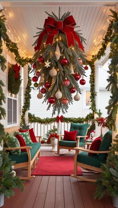 a porch decorated for christmas with wreaths and ornaments