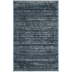 an area rug with black and white stripes on the bottom, in front of a white background