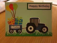 a birthday card with a tractor and balloons