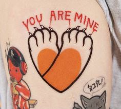 a person with a tattoo on their arm that says, you are mine and two hands in the shape of a heart