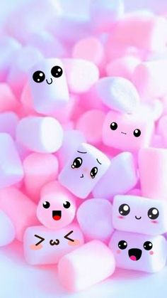 pink marshmallows with faces and eyes on them