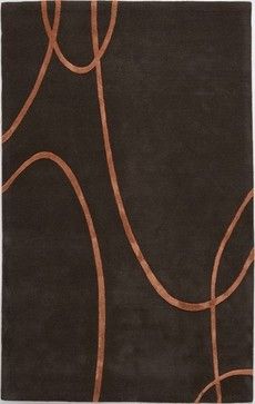 a brown rug with an abstract design on it