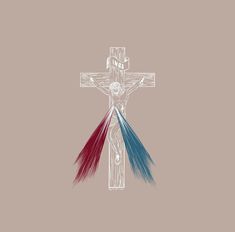 a cross with three colored feathers on it