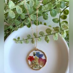 Pressed Wild Flower Necklace | Multi Flower Necklace | Resin Jewelry | Resin Dry Flower Necklace | Resin Dried Flower Necklace Forget Me Not Material: Resin Handmade Item. Materials: 18k Gold Plated Charm: Mix Of Pressed Dried Flowers Circle Charm's Size: 1.19in X 1.19in Heart Charm's Size: 1.57in X 1.18in Necklace's Length: 27in With 3in Extension Please Note That Due To Flower's Color Shade, Lighting Effects, Monitor's Brightness, Contrast And Other Settings, There Might Be Some Slight Differe Resin Necklace With Photo, Resin Pendants Flower, Dry Flower Jewelry, Mother's Day Pressed Flower Necklace, Multicolor Flower Jewelry With Pressed Flowers, Multicolor Flower Shaped Jewelry With Pressed Flowers, Floral Print Flower Jewelry For Gifts, Gold Jewelry With Floral Print For Gift, Bohemian Necklace With Pressed Flowers