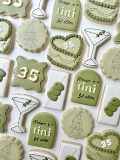 decorated cookies are displayed on a table