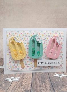 three ice cream popsicles on a card with the words have a sweet day