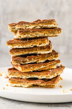 a stack of crackers sitting on top of a white plate