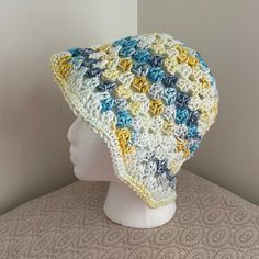 Handmade Crochet Bucket Hat in  Yellow, Blue & White Mix Colors is READY to SHIP Made with 100% Cotton  Perfect for a trip to the beach, festivals, farmer's market, or to just hang out at your favorite spot!  Great for yourself or as a gift!  ✨Handmade in my clean, smoke free home with TLC & attention to detail.  ✨Colors may vary as shown depending on the screen viewed on.  ✨Due to the nature of multicolored yarn, color placement may slightly vary.  The color placement may vary from items shown Spring Hat, Fall Hat, Bucket Hat Summer, Ombre Yarn, Spring Hats, Festival Gifts, Crochet Bucket, Crochet Bucket Hat, Fall Hats