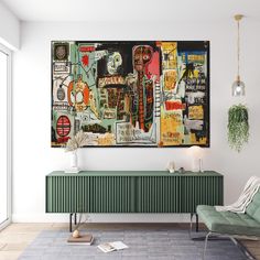 a living room with a large painting on the wall and a green chair in front of it