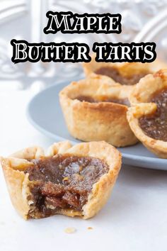 three small pies on a plate with the words maple butter tarts