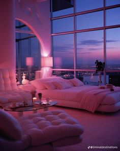 a living room filled with furniture and a large window covered in pink lights at night