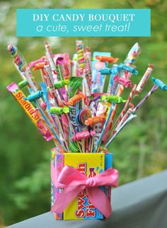 a candy jar filled with lots of different flavored candies and lollipops