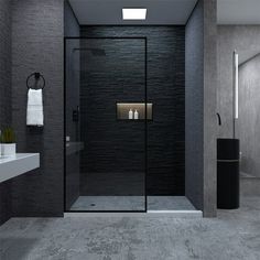 a black and white bathroom with a glass shower door