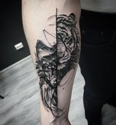 a black and white tattoo on the leg of a man with a tiger head in it