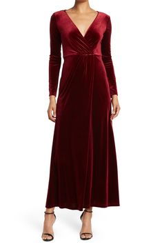 The Rosalie is a glamorous velvet maxi dress that's sure to turn covetous heads wherever you go. 57" length (size S) Surplice neck Long sleeves Back zip closure Lined Shell is 90% polyester, 10% spandex; lining is 100% polyester Machine wash, line dry Imported Model Stats: 5'10" height; 34" bust; 27" waist; 35" hips. Model is wearing size S. Bride A Line Dress, Long Sleeve Bridesmaid Dress, Velvet Dress Designs, Velvet Maxi, Velvet Maxi Dress, Daytime Dresses, Burgundy Dress, Long Bridesmaid Dresses, Lovely Dresses