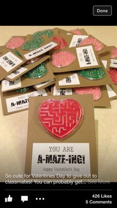 a pile of valentine's day cards sitting on top of a table next to each other