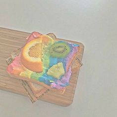 there are slices of fruit on the cutting board