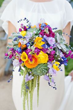 a woman holding a bouquet of flowers in front of a color swatch with the words,