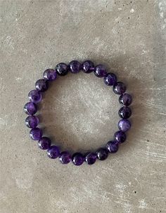 Made with beautiful amethyst beads, this bracelet is perfect for adding a touch of elegance to any outfit. This amethyst beaded bracelet is the perfect way to get in touch with your inner goddess. The vibrant purple stones are thought to promote creativity and spiritual growth, while the soft beads provide a gentle sense of grounding and calm. Wear it when you need a little bit of peace and tranquility in your life. Spiritual Amethyst 8mm Beads Jewelry, Spiritual Amethyst Jewelry With 8mm Beads, Spiritual Amethyst Bead Jewelry, Amethyst Gemstone Beads Bracelets As Gift, Amethyst Stretch Bracelet With Round Beads For Gift, Amethyst 8mm Beads Jewelry For Meditation, Purple Meditation Bracelet Jewelry, Purple Amethyst Bead Jewelry, Elegant Purple Crystal Bracelet For Meditation