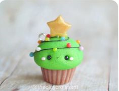 a green cupcake with a star on top