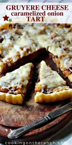 a close up of a pizza on a cutting board with text overlay that reads gruyere cheese caramelized onion tart