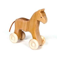 a wooden toy horse is shown on a white background