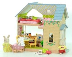 a doll house with furniture and accessories in it