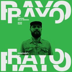 a man with a beard is standing in front of a green poster that says bravo