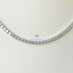 Elegant, with amazing fire and brilliance is the only way to describe this gorgeous necklace. Wear it to a special occasion or work, it is sure to capture everyone's attention. Pair this necklace together with my 3mm Moissanite tennis bracelet, and my 3mm Moissanite wedding band for a beautiful set. CERTIFICATION: Along with your necklace you will receive a GRA certificate of authenticity and warranty card. RESIZING: Each setting cannot be separated, therefore I will not be able to resize the ne Silver Diamond Cut Tennis Necklace Gift, White Gold Cubic Zirconia Tennis Necklace Gift, Silver Moissanite Tennis Necklace, Sterling Silver Round Cut Tennis Necklace For Gift, Sterling Silver Tennis Necklace Gift, Gift Sterling Silver Tennis Necklace, Gift White Gold Tennis Necklace With Vvs Clarity, White Moissanite Tennis Necklace Perfect As A Gift, Moissanite Tennis Necklace With Brilliant Cut As A Gift