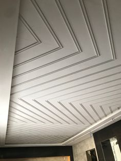 the ceiling is white and has lines painted on it