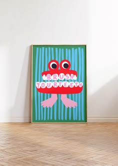 a green and blue poster with a red frog on it's face in front of a white wall