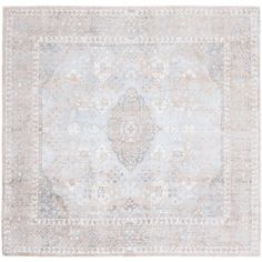 an antique rug with light blue and beige colors on the ground, in front of a white background