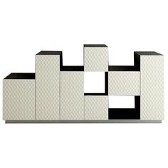 a white and black shelf with squares on it