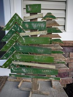 a christmas tree made out of wooden planks