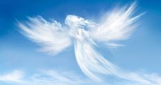 an angel shaped cloud in the blue sky