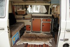 the interior of a camper van with its door open