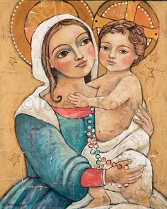 an image of the virgin mary holding a child