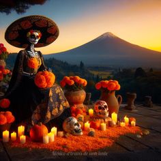 a woman sitting on top of a wooden table covered in orange flowers and skulls next to candles