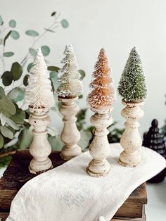 small wooden trees are sitting on top of a napkin