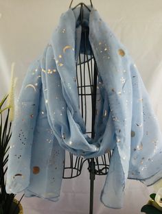 Scarf Women Celestial Sky Blue Blue Moon and Stars Scarf Moon & Star Summer Day Night Scarf  Scarf Gift Scarf Sky Blue Blue Scarf ALL ORDERS  HAVE TRACKING AND INSURANCE Celestial Scarf This Celestial scarf is great all year round, it has Rose Gold  Moon & Stars scattered all over it   It's a great accessory for many outfits, lightweight so it's great for day or evening wear. A Gorgeous statement piece Scarf available in 4 different colourswhite, navy, mint green and sky blue Please choose your Gold Moon, Blue Scarf, Scarf Women, Scarf Gift, Moon And Stars, Moon Star, Day Night, Blue Moon, Summer Day