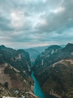 an aerial view of a river in the mountains