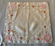 This is a charming, vintage semi-sheer silk handkerchief. Hand embroidered with purple, pink & red flowers. It is off white with a stitched, scalloped edge.  This hanky is in good, vintage condition. Shows a small water mark & smudge in the center. No other soil, damage or stains.  Sweet. Pink Red Flowers, Silk Handkerchief, Water Mark, Vintage Handkerchiefs, Semi Transparent, Scalloped Edge, Red Flowers, Pink Red, Scarf Wrap