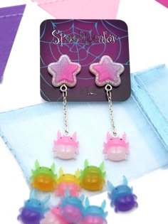 "This listing is for a pair of stag beetle and a shiny little star stud. This is another combination for those who like a bit of a statement. I hope you will also love the pastel combination of cute and spooky they display and how they hang on your ears. If you wish to see more earrings you can find all the combinations on my \"Halloween earrings\" section. When you buy 10 pairs or more as party gifts you have the option to personalize them by \"writting the name, date or holiday / special day\" Cute Etsy Finds, Silly Earrings, Spooky Font, Earring Displays, Cute Creepy, Cute And Spooky, Stag Beetle, Accessories Cute, Holiday Earrings