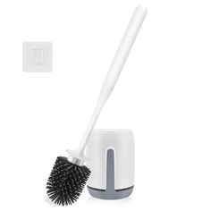 a white brush is sitting on top of a holder