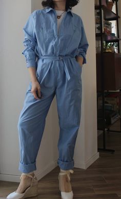 Vintage 70s work jumpsuit overall. Long front zip, two large pockets on the bust, belt with metal straps at the waist, side pockets. Metal snap buttons on the cuffs. Very long trousers, to be rolled up or shortened. Light blue, 100% cotton. Made in Italy. Excellent vintage conditions. Unisex Signed size 46 italian (14 uk). Best fit from size 10 uk (oversize) to 14 uk. Model's size 8 uk, h 163 cm. Blue Utility Jumpsuits And Rompers For Work, Light Blue Jumpsuit, Work Jumpsuit, Green Jumpers, Blue Jumpsuit, Prussian Blue, Blue Jumpsuits, Metal Straps, Long Trousers