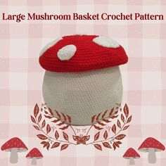 a crocheted mushroom hat with white polka dots on the top and red trim