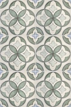 an artistic tile design in shades of green and blue, with circles on the side